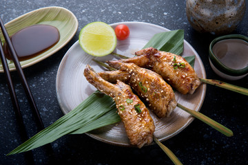 Grilled chicken wings with teriyaki sauce.