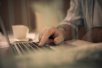 Fototapeta na wymiar Close-up hand typing keyboard computer.