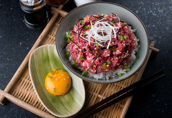 Raw tuna and onion with rice in Japanese style.