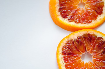 Sliced orange Citrus sinensis  'Blood orange' on white ground