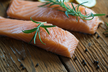 Raw salmon filet on dark slate background, wild atlantic fish