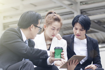Business women and men are talking.