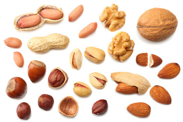 mix almonds, cashew nuts, hazelnut, peanuts, walnuts, pistachio isolated on white background. Top view