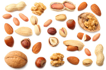 mix almonds, cashew nuts, hazelnut, peanuts, walnuts, pistachio isolated on white background. Top view