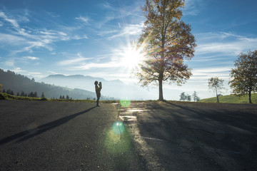 Obraz premium Silhouette of Woman Holding Baby in the Swiss Alps