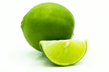 Limes with slices  on white background.