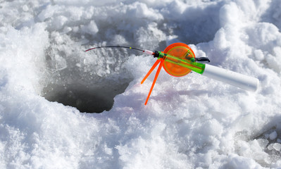 A small rod on the ice in winter