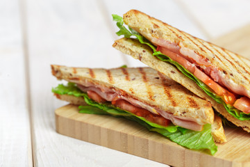 Club sandwich on wooden table