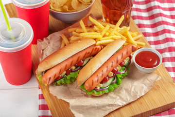 Hot dogs on wooden background