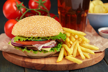 Fast food, homemade burger on a wooden background