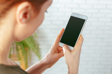 close up of woman texting on smartphone