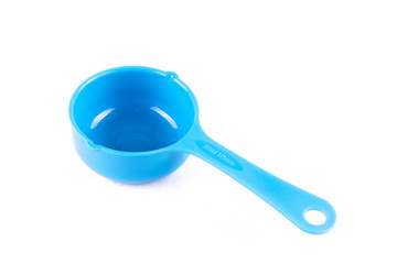 Measuring spoon or cup over the white background.