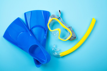 Blue flippers on color background © George Dolgikh