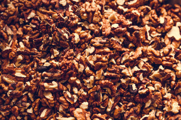 Walnut texture. Heap of nuts. Peeled nuts. Background of nuts. Healthy food concept.
