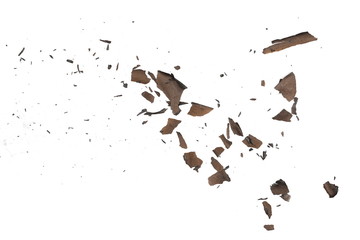 Burned, charred paper scraps isolated on white background, top view