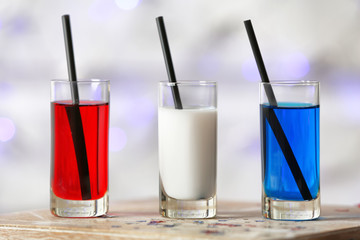 Cocktails in colors of American flag on table