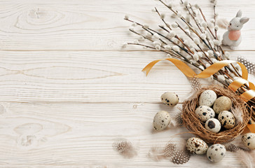 Easter background with Easter eggs and spring flowers. Top view with copy space.