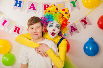 clown girl on the birthday of a child. A party for a child. Adult baby boy
