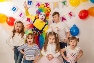 clown girl on the birthday of a child. Party for children. Play and entertain boys and girls