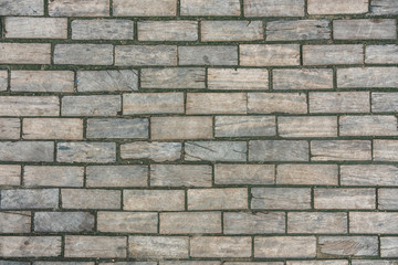 Wooden bricks shaped like concrete material wall, texture with scratches