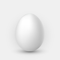 Realistic white egg with shadow on white background