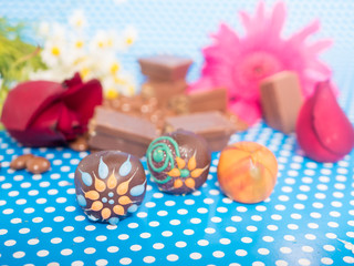 Fototapeta na wymiar Homemade chocolates on blue background