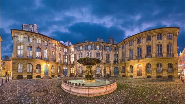 Panorama of Place Albertas square at dusk in Aix-en-Provence, France (static image with animated sky and water)