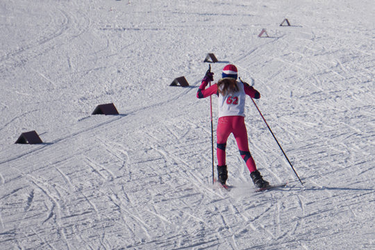 A woman skier working on a ski run at the city ski marathon