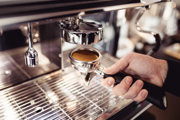 Procedure of making fresh espresso coffee. 