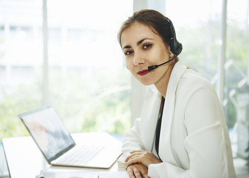 women happy smiling customer support operator with headset. communication concept.