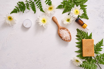 Obraz na płótnie Canvas bathroom salt, soap and aroma oil for spa on white background top view mock-up