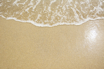 Fototapeta na wymiar Sea Beach and Soft wave of blue ocean. Summer day and sandy beach background