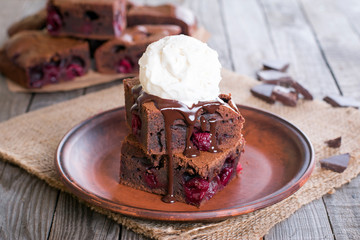 Chocolate brownie with cherry and ice cream