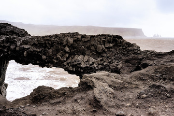 View through a rock formation to the sea