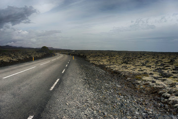 Empty road through the lava fields in Iceland