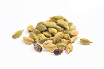 Organic cardamom pods on white background