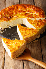Delicious sliced rice pie with ricotta cheese close-up. vertical