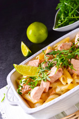 Salmon with penne noodle and arugula