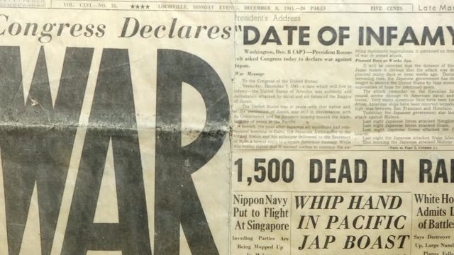 Panning view of newspaper talking about World War II, dated December 8, 1941