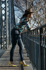  Beautiful girl having fun in the iron bridge