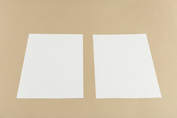 White business card on wooden table. Blank portrait A4.