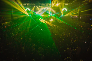 Crowd throwing lasers during live concert