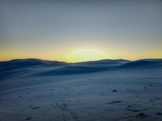 Beautiful orange sunset in arctic mountains 