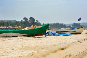 Fototapeta premium Fishing boats on the sand on Arambol beach in North Goa.India 