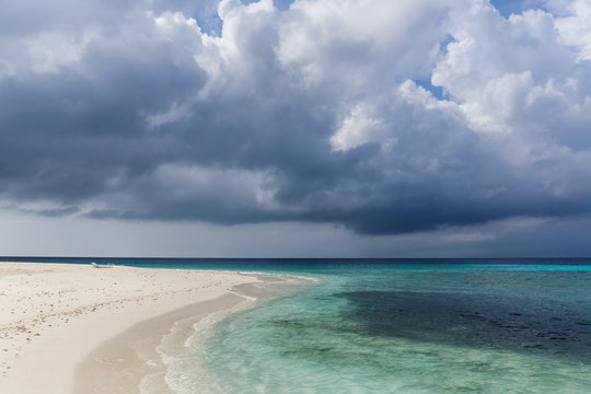 scenic view of coastline and dark cloudy sky, maldives, thoddoo