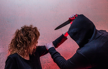 a man attacks a woman with a knife