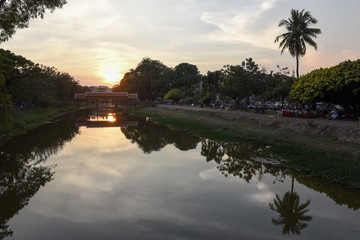 Fototapeta na wymiar River with bridge and night market in Siem Reap, Cambodia