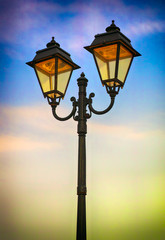 Fototapeta na wymiar Street lamp against evening sky