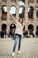 Fototapeta na wymiar Tourist woman at colosseum monument in Rome