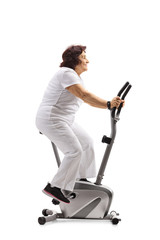 Elderly woman working out on a stationary bike